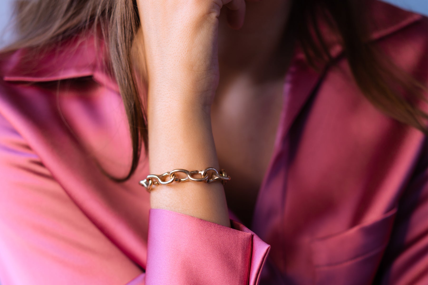 Model wearing a bronze bracelet